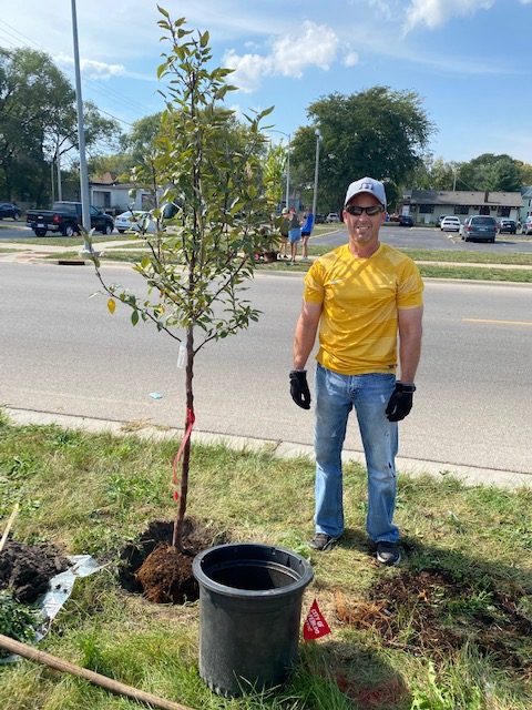 CFCCU waterloo branch plants trees along 4th street.